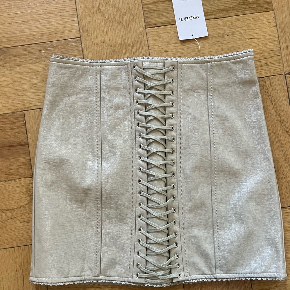 Off white faux leather cross cross tie mini skirt